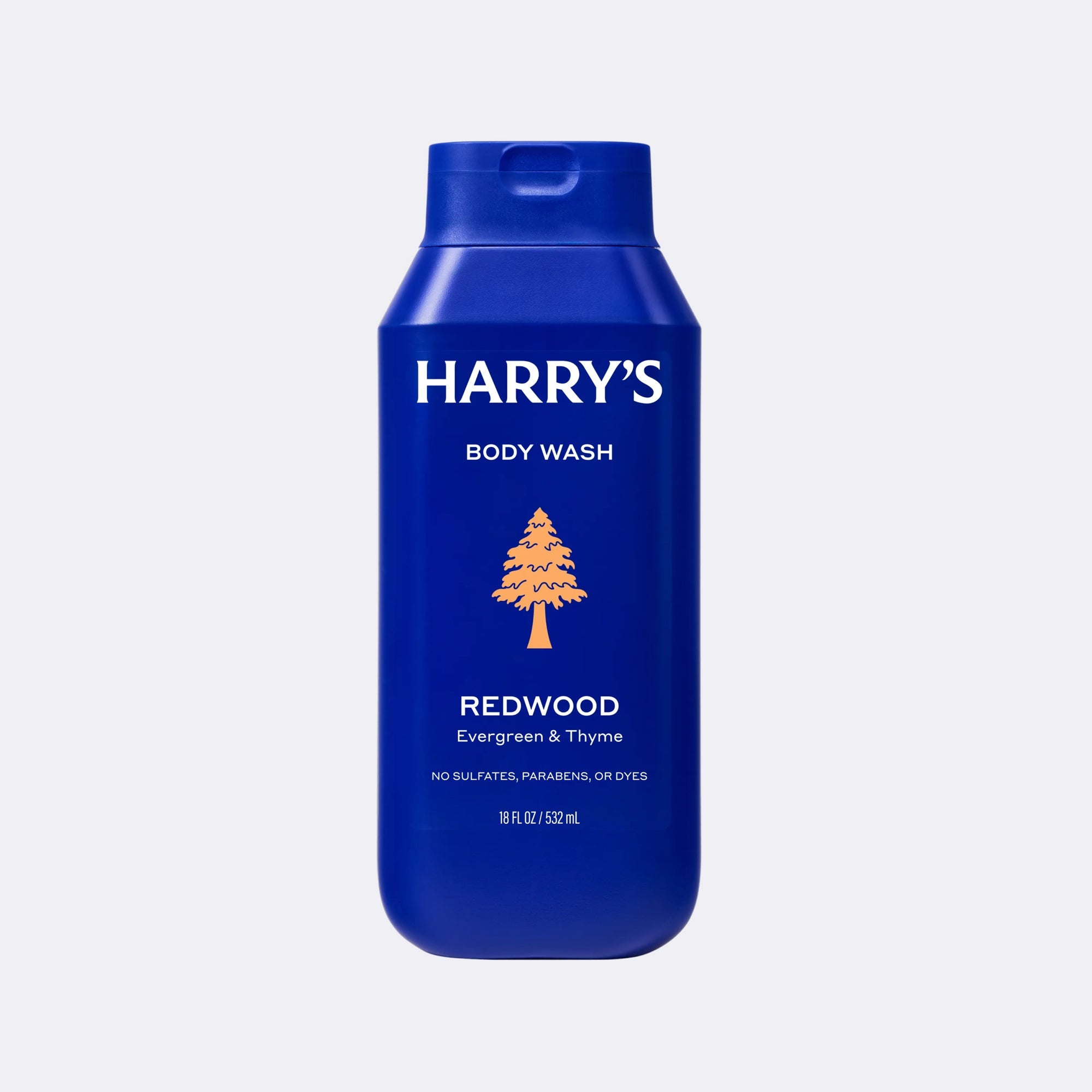 A blue bottle of Harry's Body Wash, Redwood scent, on a light gray background.