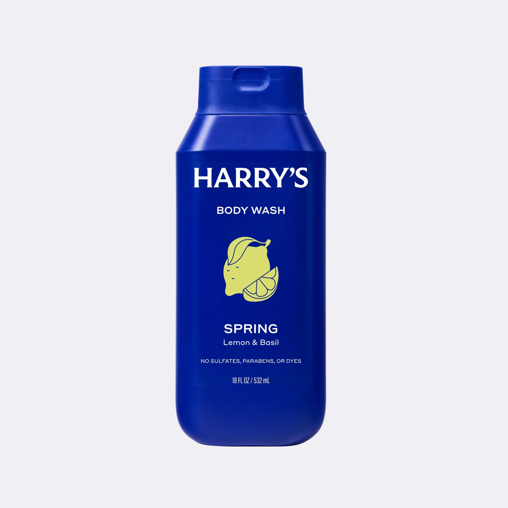 A 500ml bottle of Harry's Body Wash in the Spring Lemon & Basil scent, featuring a vibrant blue bottle with a yellow lemon illustration and white text, set against a light gray background.