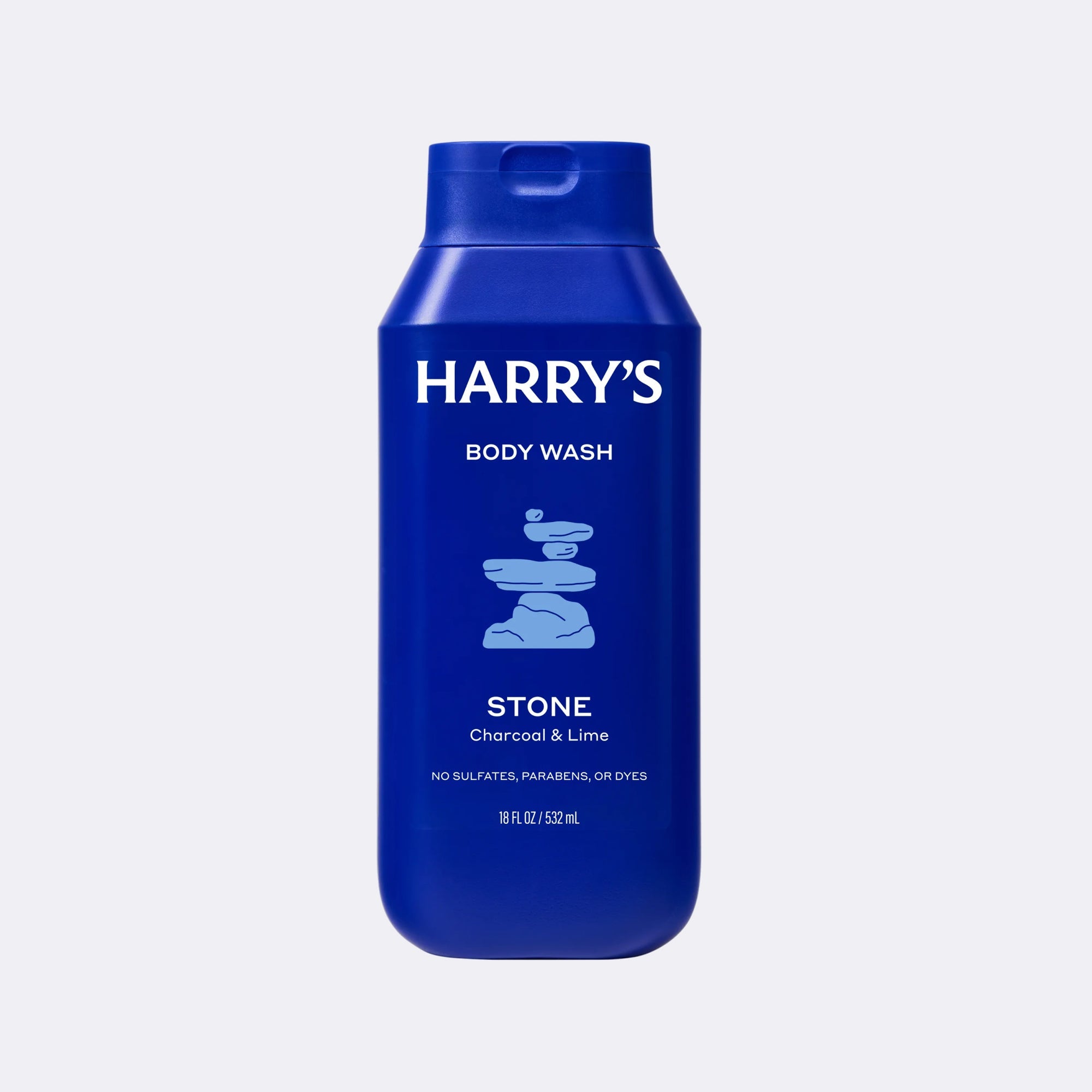 A blue bottle of Harry's Body Wash, Stone (Charcoal & Lime) scent, on a light gray background.