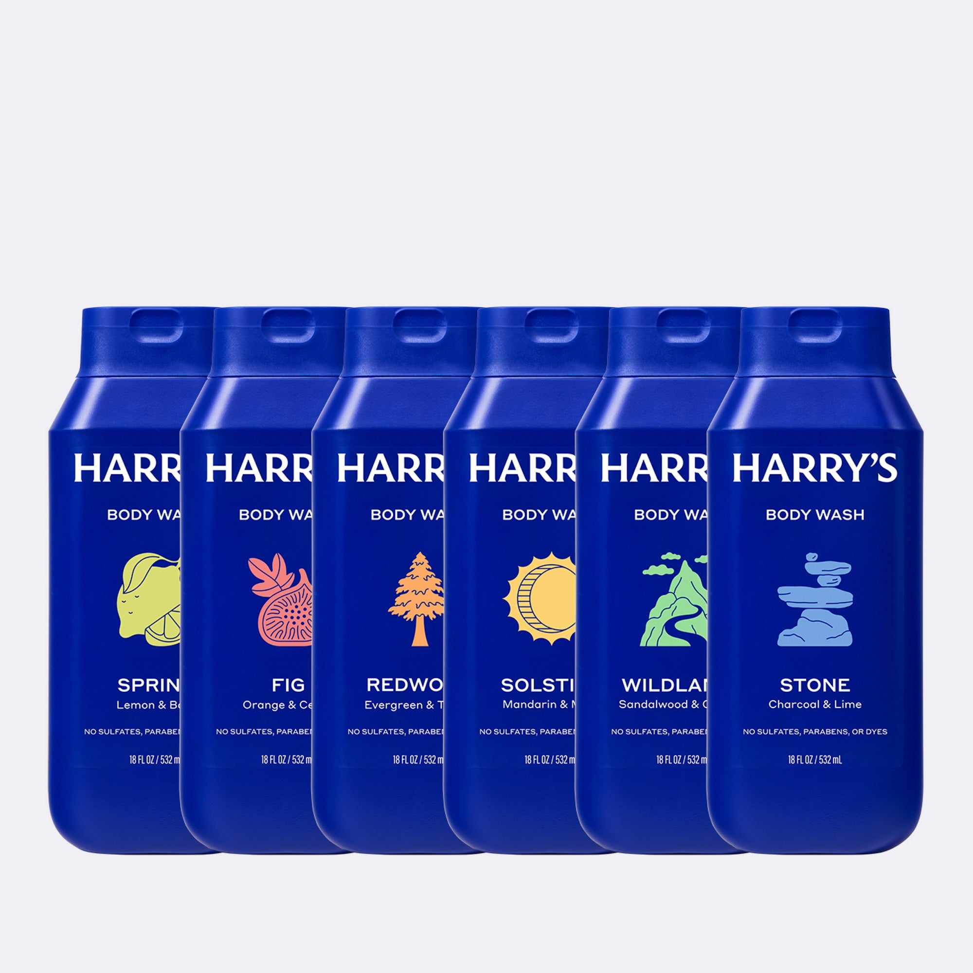 Six blue bottles of Harry's Body Wash lined up against a light gray background, showing different scent options with colorful leaf and tree illustrations.