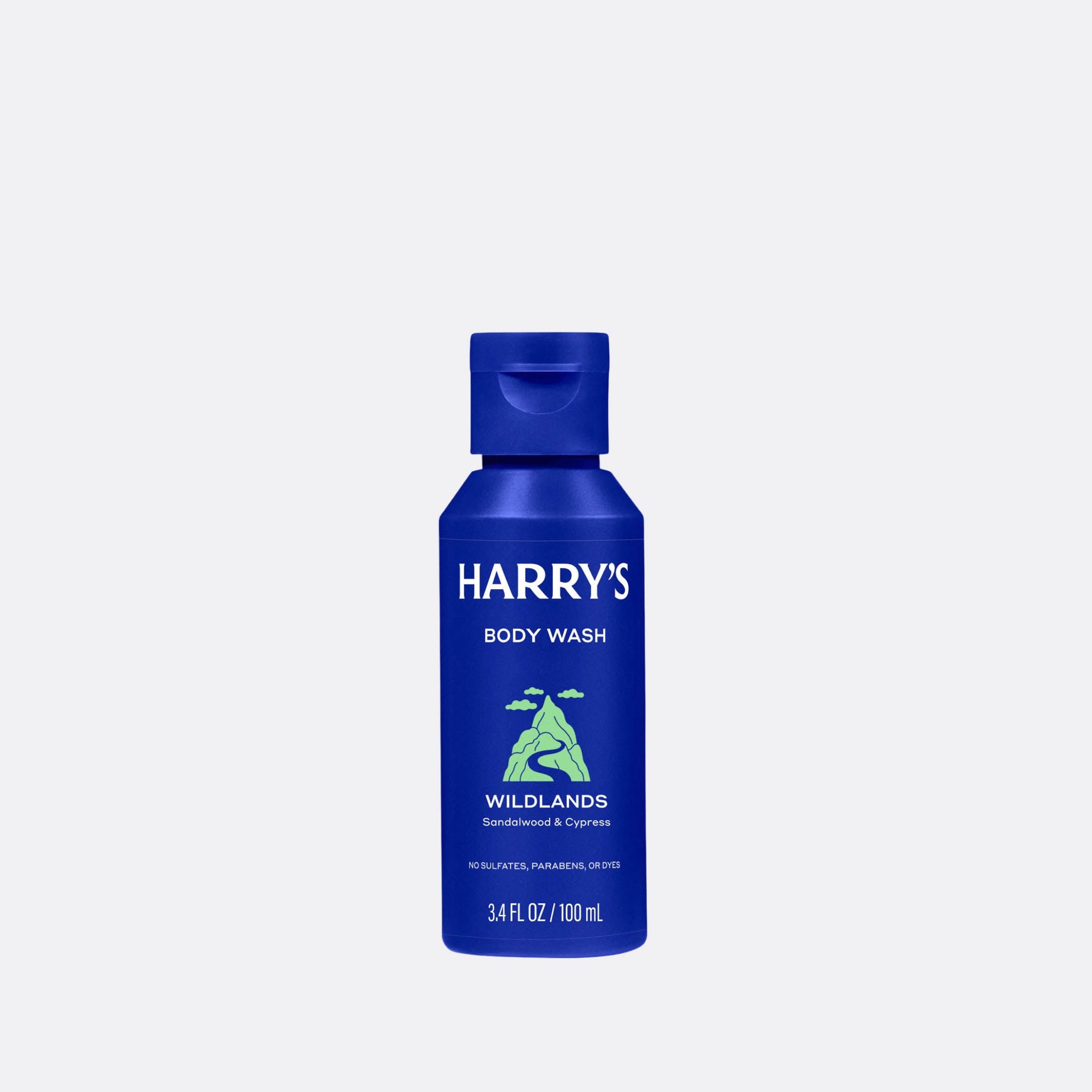 Blue bottle of Harry's Wildlands body wash on a light gray background