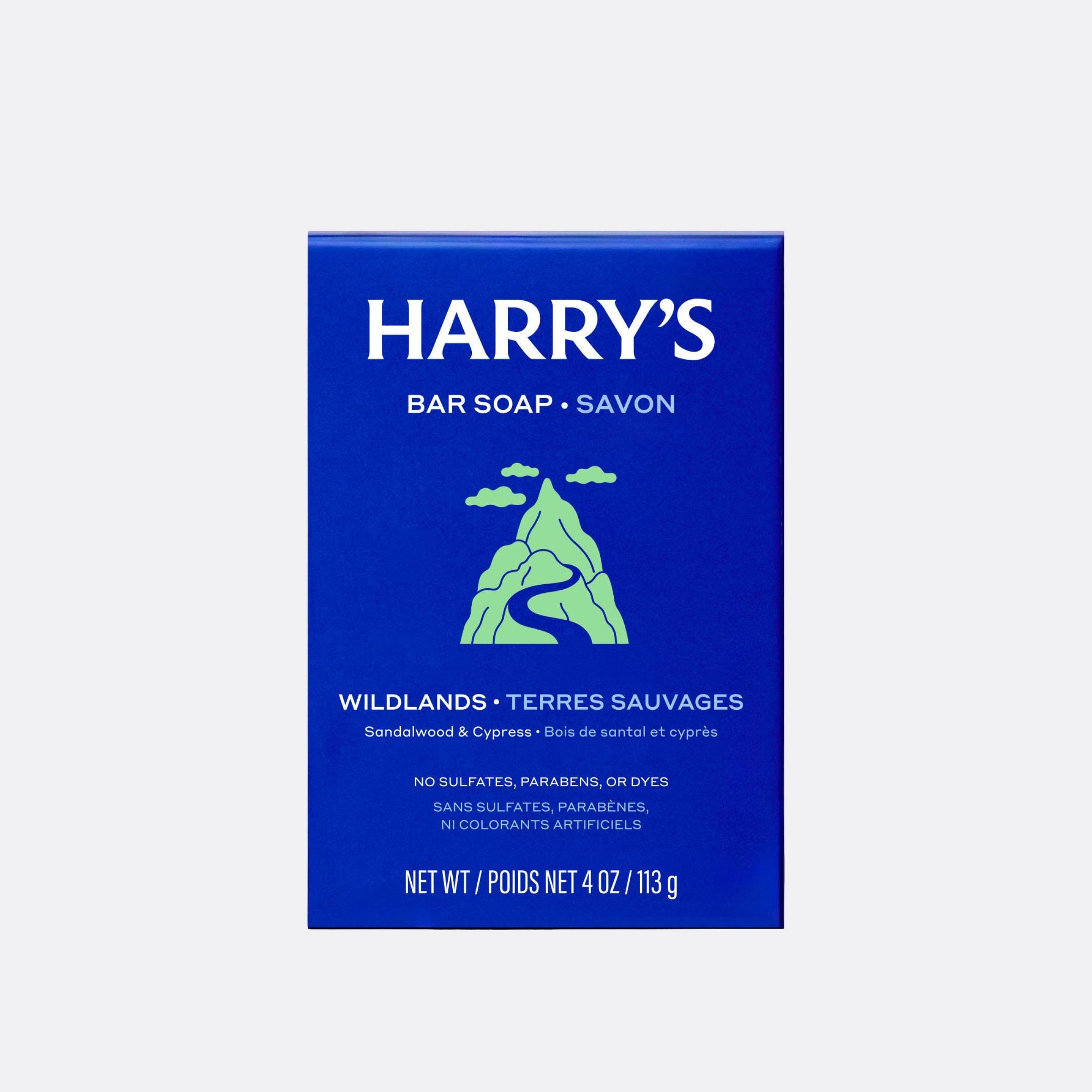 A blue rectangular box of Harry's Bar Soap, Wildlands, with white text and a green mountain graphic, centered on a light gray background.