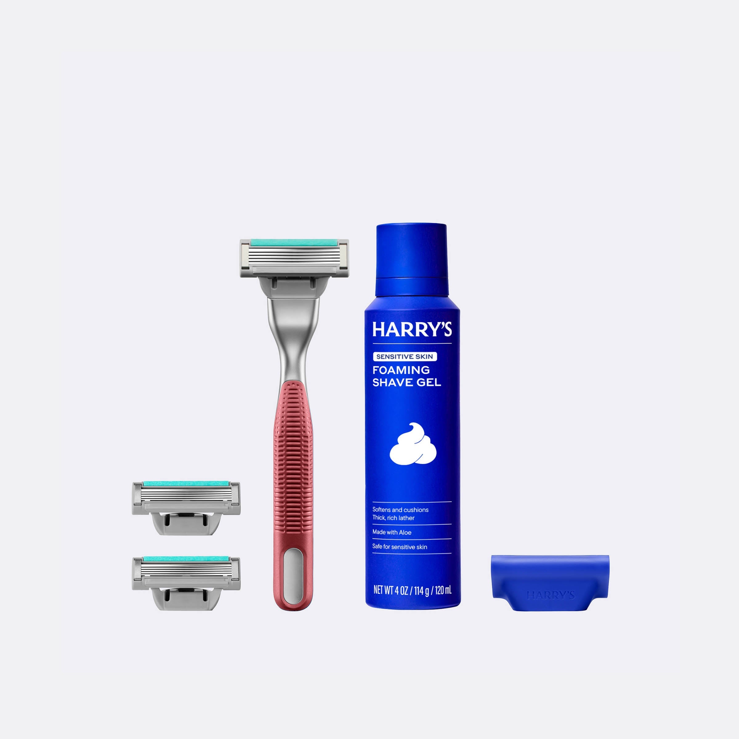 Harry's shaving product set including a razor, shaver heads, and foaming shave gel on a white background