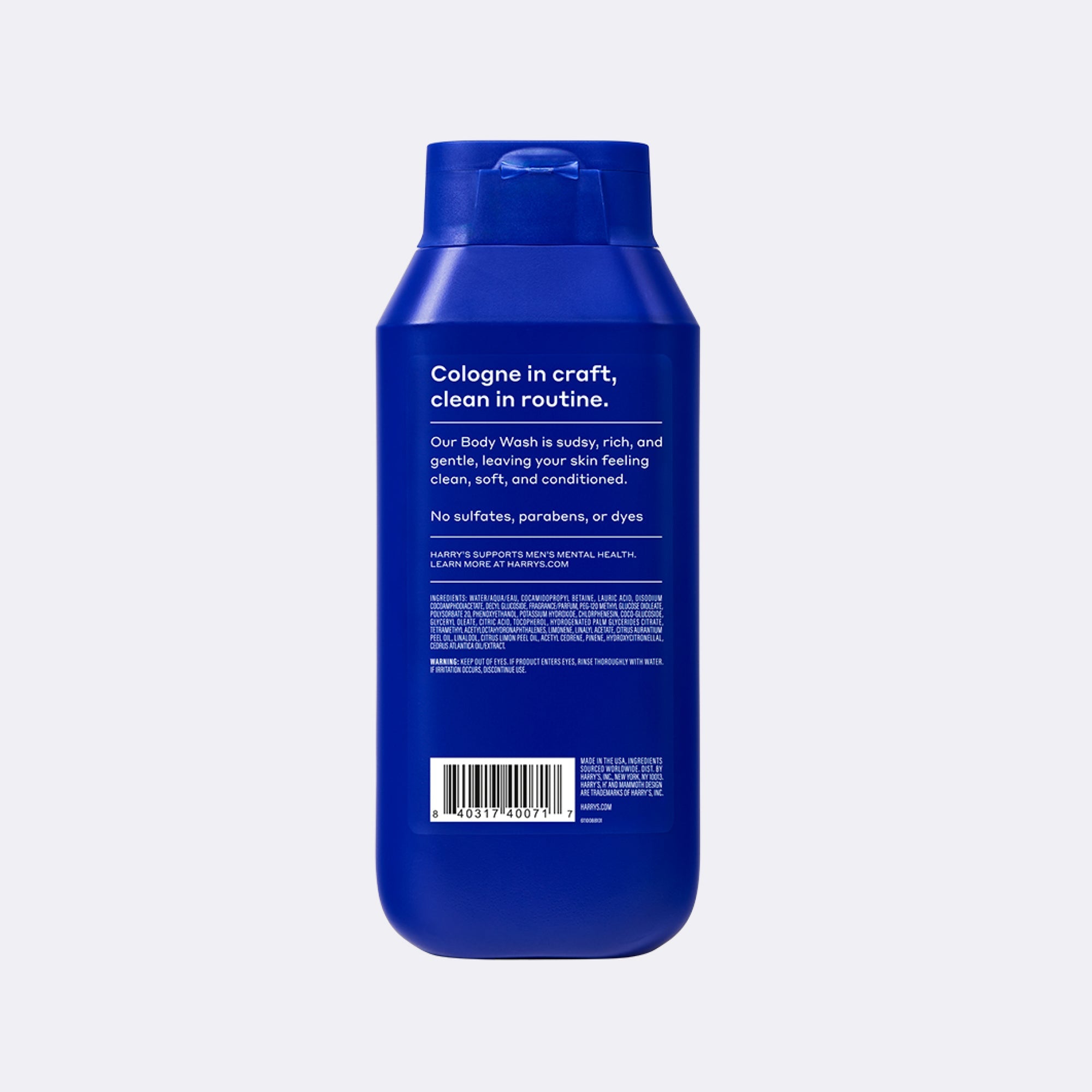 A blue bottle of Cologne in Craft body wash shown from the back against a light gray background.