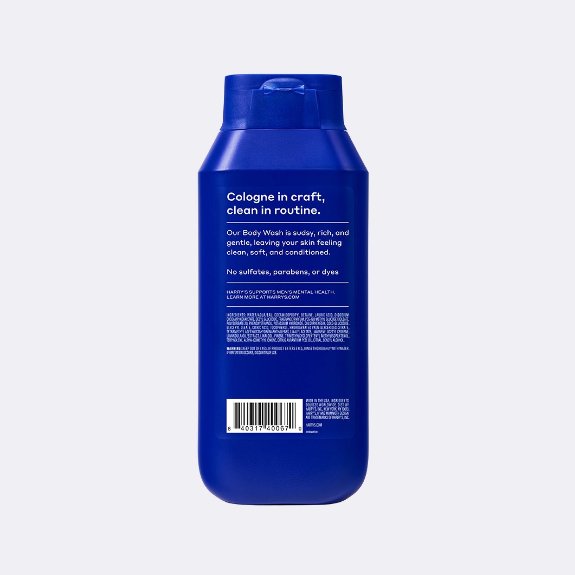 A blue plastic bottle of Cologne in Craft body wash, shown from the back against a light gray background.