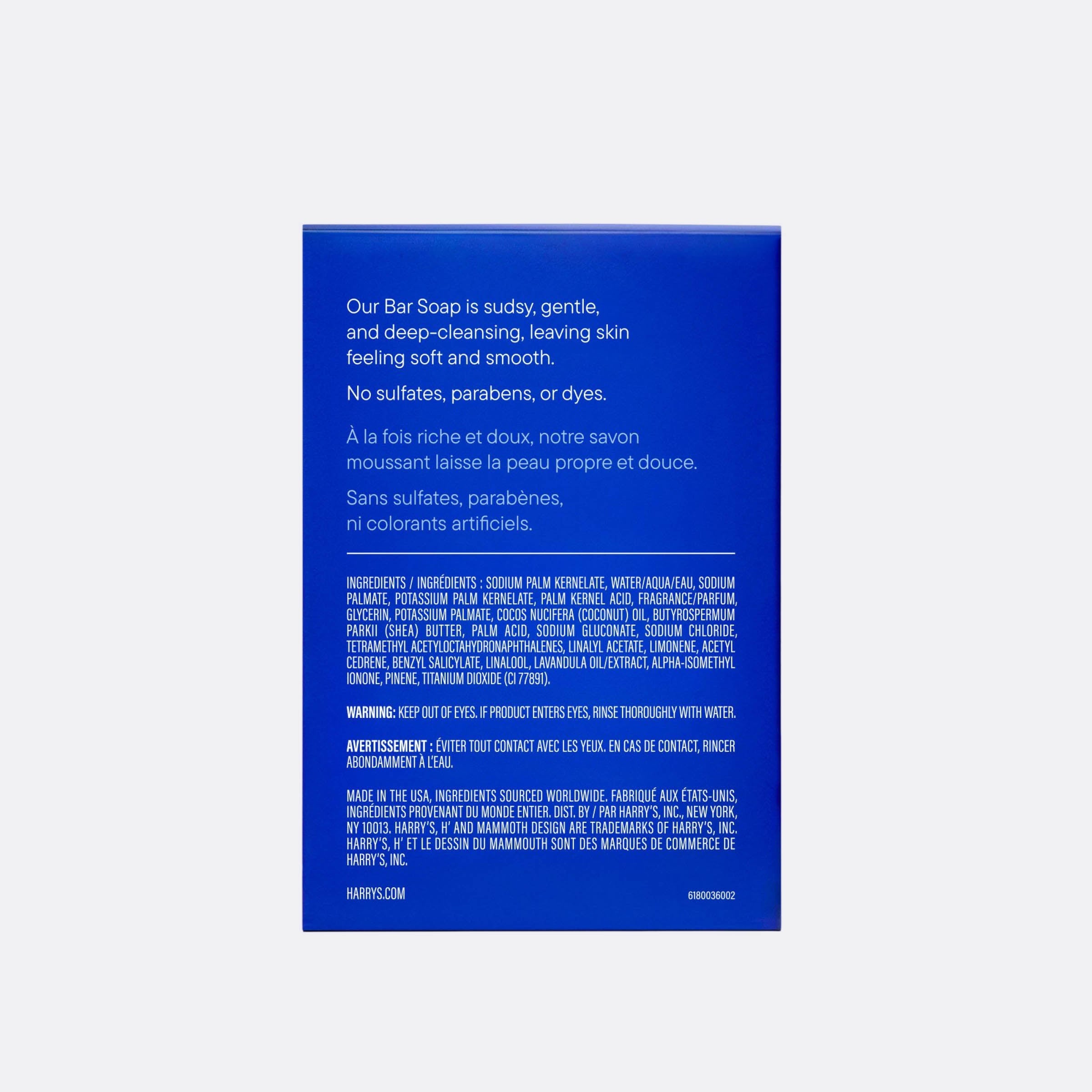 The back of a blue Harry's Bar Soap box, showing product description text in English and French and a list of ingredients in small white text, on a light gray background.
