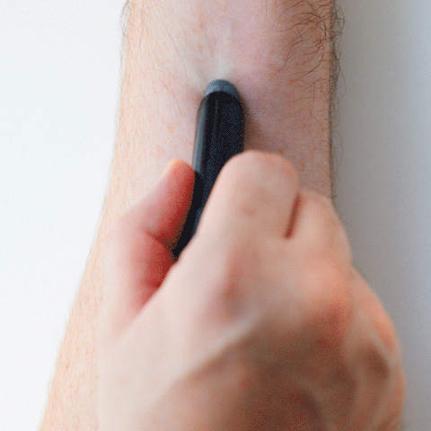 Gif of a person swiping the lip balm on their arm.