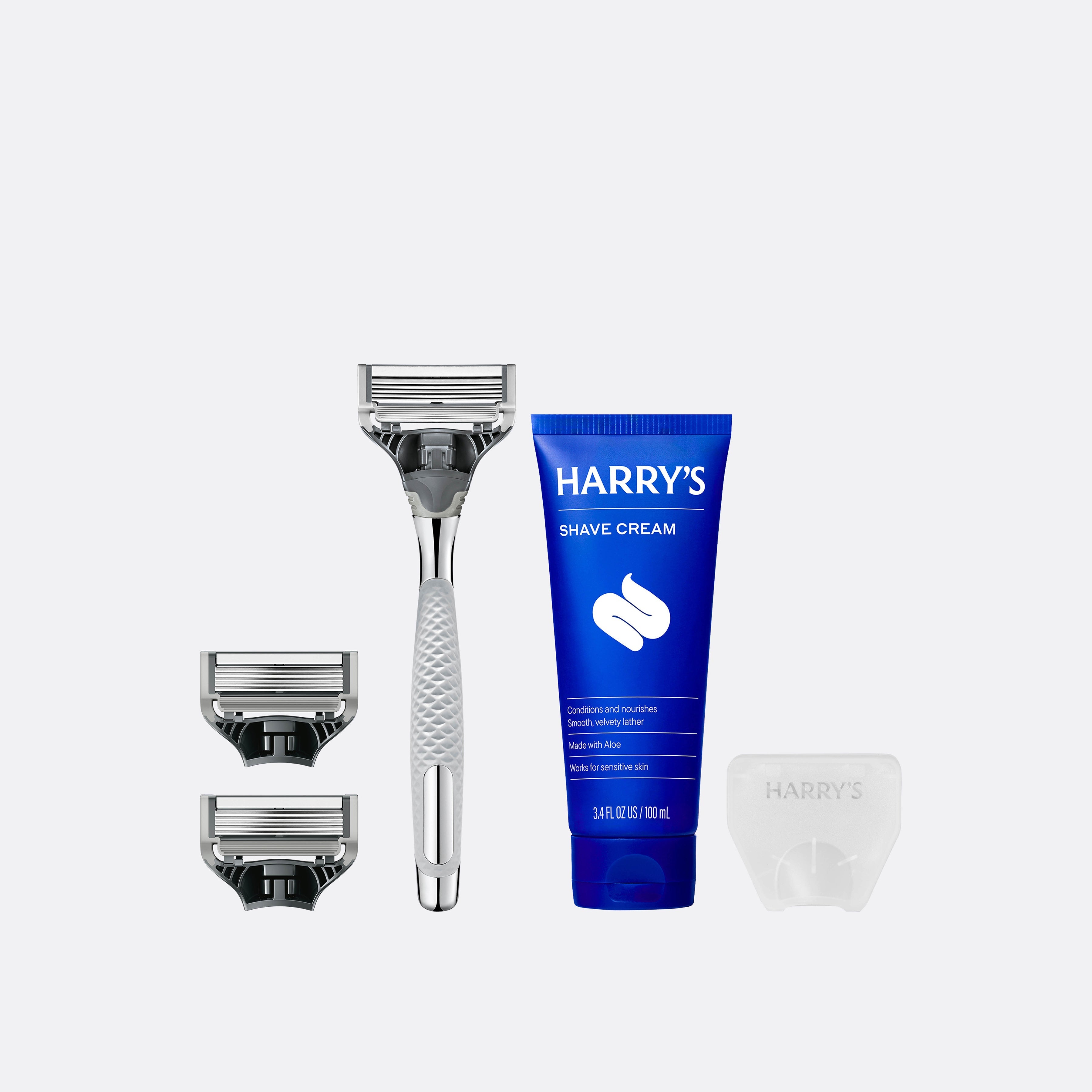 Two blades, Chrome Winston razor, shave cream and the Travel Blade cover.